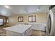 Open concept living room features a bright kitchen and luxury vinyl plank floors at 10465 E Dutchmans Trl, Gold Canyon, AZ 85118