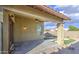 Back patio area looking out to fenced yard, artificial turf and pool in view at 10465 E Dutchmans Trl, Gold Canyon, AZ 85118