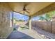 Covered patio perfect for outdoor entertaining, overlooking the backyard with an artificial turf feature at 10465 E Dutchmans Trl, Gold Canyon, AZ 85118