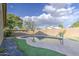 Beautiful backyard featuring a private in-ground pool with lush landscaping at 10465 E Dutchmans Trl, Gold Canyon, AZ 85118