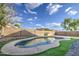 Backyard showcasing a private in-ground pool and low-maintenance artificial turf at 10465 E Dutchmans Trl, Gold Canyon, AZ 85118