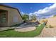 Backyard showcasing a refreshing pool, complemented by artificial turf and a cozy patio area at 10465 E Dutchmans Trl, Gold Canyon, AZ 85118
