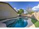 Backyard pool view with lush turf and easy access to the home's rear entrance at 10465 E Dutchmans Trl, Gold Canyon, AZ 85118