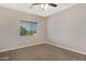 Bedroom with carpeted floor and view of neighborhood at 10758 E Lobo Ave, Mesa, AZ 85209
