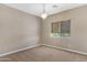 Bedroom with carpeted floor, chandelier, and window at 10758 E Lobo Ave, Mesa, AZ 85209
