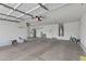 Spacious garage with high ceilings, ample storage space, and plenty of room for multiple vehicles at 10758 E Lobo Ave, Mesa, AZ 85209