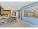 Open layout showing kitchen, staircase and living space, with neutral walls and tile flooring at 10758 E Lobo Ave, Mesa, AZ 85209
