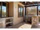 An outdoor kitchen with stainless steel appliances, counterspace, and storage at 10758 E Lobo Ave, Mesa, AZ 85209