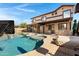 Gorgeous backyard with a private pool, spa, built-in barbecue, and patio area for entertaining at 10758 E Lobo Ave, Mesa, AZ 85209