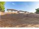Wide view of the backyard showing desert landscaping surrounded by a block wall at 11221 W Devonshire Ave, Phoenix, AZ 85037