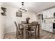 Cozy dining area features a wood table and is conveniently located next to the kitchen at 11221 W Devonshire Ave, Phoenix, AZ 85037