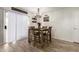 Cozy dining area featuring a wooden table with seating for four at 11221 W Devonshire Ave, Phoenix, AZ 85037