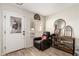 Inviting entryway with tile floors, decor, and a cozy reading corner at 11221 W Devonshire Ave, Phoenix, AZ 85037