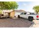 Charming single-story home with a well-maintained front yard and a two-car garage at 11221 W Devonshire Ave, Phoenix, AZ 85037