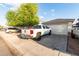 View of the home's front exterior, highlighting the garage and driveway at 11221 W Devonshire Ave, Phoenix, AZ 85037