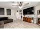 Spacious living room with a ceiling fan and tile floors at 11221 W Devonshire Ave, Phoenix, AZ 85037