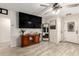 Spacious living room featuring a ceiling fan and tile floors at 11221 W Devonshire Ave, Phoenix, AZ 85037
