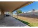 A covered patio overlooks a spacious backyard, perfect for outdoor entertaining and relaxation at 11341 W Barbara Ave, Peoria, AZ 85345