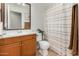 Well-maintained bathroom featuring a classic wood vanity and shower with curtain at 11341 W Barbara Ave, Peoria, AZ 85345