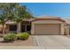 Inviting single-story home with low-maintenance landscaping and a two-car garage at 11341 W Barbara Ave, Peoria, AZ 85345