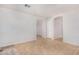 Open living area features neutral walls, tile floors, and ample space for flexible furnishing arrangements at 11341 W Barbara Ave, Peoria, AZ 85345