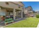 Backyard with artificial turf, covered patio and outdoor seating at 11526 E Shepperd Ave, Mesa, AZ 85212
