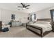 Spacious bedroom featuring a ceiling fan, neutral carpet, and ample natural light at 11526 E Shepperd Ave, Mesa, AZ 85212