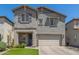 Beautiful two-story home featuring a neutral color palette, well-maintained landscaping, and a two-car garage at 11526 E Shepperd Ave, Mesa, AZ 85212