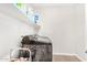 Laundry room features a modern washer and dryer with storage shelves above at 11526 E Shepperd Ave, Mesa, AZ 85212