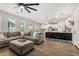 Comfortable living area with an open layout, seamlessly connected to a modern kitchen at 11526 E Shepperd Ave, Mesa, AZ 85212