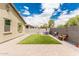 Backyard featuring artificial turf, desert landscaping, and a block wall at 12357 W Whyman Ave, Avondale, AZ 85323