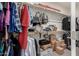 Walk-in closet with ample storage space with clothing, bags, boxes and other belongings at 12357 W Whyman Ave, Avondale, AZ 85323