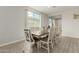 Inviting dining room with a large table, seating for ten, light walls, and tile flooring at 12357 W Whyman Ave, Avondale, AZ 85323