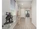Bright entryway featuring tile flooring, neutral walls, and modern decor, leading into the home at 12357 W Whyman Ave, Avondale, AZ 85323