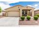Charming single-story home featuring a covered porch with a swing and a well-maintained front yard at 12357 W Whyman Ave, Avondale, AZ 85323