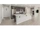 Spacious kitchen with dark wood cabinets, stainless steel appliances, and large center island at 12357 W Whyman Ave, Avondale, AZ 85323
