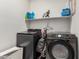 Laundry room features updated washer and dryer on light-colored tile flooring at 12357 W Whyman Ave, Avondale, AZ 85323