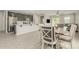 Open living space showcasing a modern kitchen, dining area, and a view into a comfortable living room at 12357 W Whyman Ave, Avondale, AZ 85323
