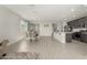 Open concept living space featuring neutral walls, tile floors, kitchen, dining table, and living room at 12357 W Whyman Ave, Avondale, AZ 85323