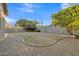 Expansive backyard featuring mature trees, providing shade and privacy at 1258 W Plane Tree Ave, San Tan Valley, AZ 85140