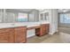 Bright bathroom featuring double sinks, spacious vanity, and a view into the glass shower at 1258 W Plane Tree Ave, San Tan Valley, AZ 85140