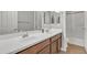 Bathroom featuring double sinks with a large mirror at 1258 W Plane Tree Ave, San Tan Valley, AZ 85140