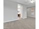 Spacious bedroom showing adjoining bathroom, carpeted floors, and natural light at 1258 W Plane Tree Ave, San Tan Valley, AZ 85140