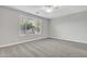 Large, neutral bedroom with a lot of natural light and soft carpet at 1258 W Plane Tree Ave, San Tan Valley, AZ 85140