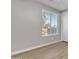 Bedroom with wood-look flooring and a window at 1258 W Plane Tree Ave, San Tan Valley, AZ 85140