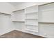 Walk-in closet with built-in shelving and clothing rods ready for lots of storage at 1258 W Plane Tree Ave, San Tan Valley, AZ 85140