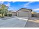 Charming single-Gathering home showcasing a well-maintained yard and two-car garage at 1258 W Plane Tree Ave, San Tan Valley, AZ 85140