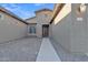 Inviting home entrance featuring stone accents and a well-lit walkway at 1258 W Plane Tree Ave, San Tan Valley, AZ 85140