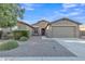 Well-manicured front yard with desert landscaping and inviting home exterior at 1258 W Plane Tree Ave, San Tan Valley, AZ 85140
