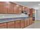 Well-equipped kitchen featuring granite countertops, stylish cabinetry, and stainless-steel appliances at 1258 W Plane Tree Ave, San Tan Valley, AZ 85140